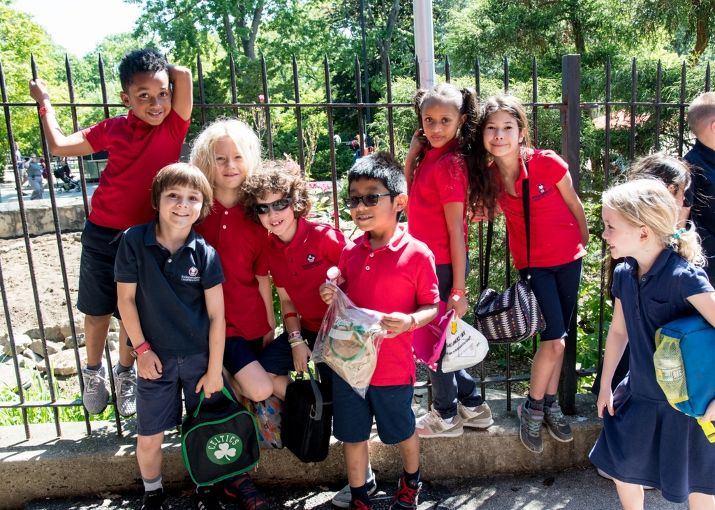 Photo of a group of elementary-aged students posing together.