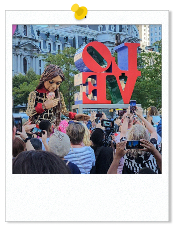 Photo of Little Amal in Love Park, 2023.