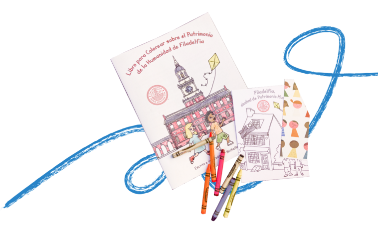 Photo of the coloring book, displayed along with various crayons and a blue twirl is drawn behind it.
